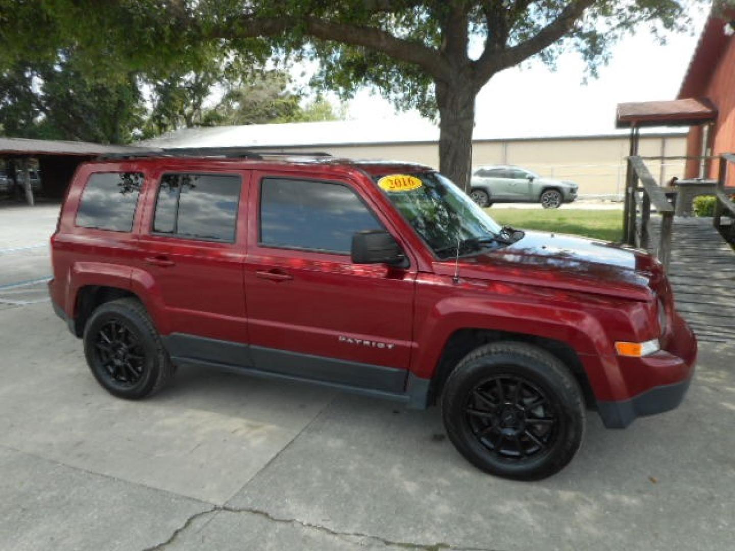 2016 RED JEEP PATRIOT SPORT (1C4NJRBB5GD) , located at 10405 Abercorn Street, Savannah, GA, 31419, (912) 921-8965, 31.988262, -81.131760 - Photo#2